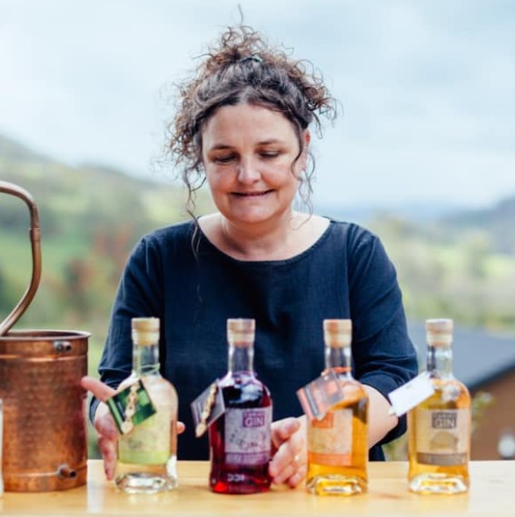 Cariad Gin founder with bottles