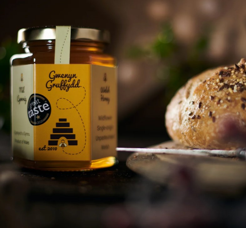 Gwenyn Gruffydd honey on table with bread