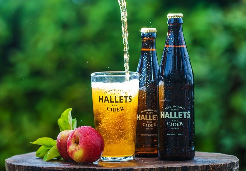 Hallets bottles and glass on stump