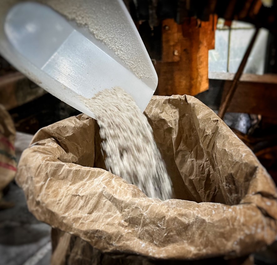 Talgarth Mill pouring flour into sack